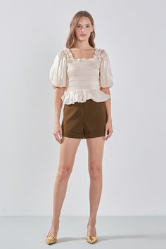 Feminine and timeless, this smocked top from endless rose will become a go-to in your wardrobe. With its fitted silhouette, square neckline, blouson short sleeves and elastic ruffled shoulders, it's designed to flatter. The smocking adds texture and depth to the piece while shirring at the peplum adds movement. For a timeless look, pair with classic denim or a floaty skirt, ideal for everything from casual days out to nights on the town. Fitted Square neckline Blouson short sleeves Smocking bodi Chic Smocked Square Neck Top With Ruched Detail, Chic Smocked Top With Ruched Square Neck, Summer Puff Sleeve Top With Ruffles And Square Neck, Casual Puff Sleeve Top With Square Neck, Ruched Smocked Top With Square Neck For Day Out, Summer Ruched Puff Sleeve Top With Square Neck, Square Neck Puff Sleeve Top With Ruffles For Brunch, Trendy Puff Sleeve Top With Ruffles And Square Neck, Feminine Smocked Top With Square Neck