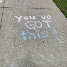 chalk writing on sidewalk that says, you've got this in blue and white