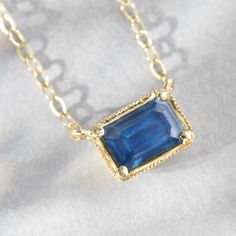 Our classic east west set emerald cut blue sapphire radiates a soothing blue shade for that perfect pop of color on your neckline. 14K sustainable gold 0.65ct emerald cut blue sapphire 16" chain with 15" option, lobster clasp closure Dimensions: 1/3" x 1/4"Delivery: Please allow up to 1-2 weeks for delivery. For rush orders please contact our Concierge. Sapphire Necklace Pendants, Appointment Book, Sapphire Pendant, Fine Jewels, Pop Of Color, East West, Necklace Jewelry, Emerald Cut, Blue Sapphire