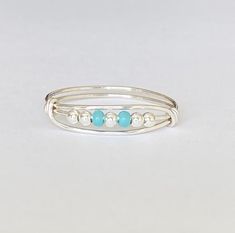 Made with sterling silver plated beads and  turquoise glass beads Comfortable to wear Silver plated band is tarnish resistant Adjustable Silver Beads Toe Ring, Adjustable Beaded Silver Rings, Bohemian Silver Beaded Rings, Turquoise Beaded Rings As A Gift, Turquoise Beaded Rings As Gifts, Adjustable Silver Beaded Rings As Gift, Fidget Jewelry, Silver Wire Rings, Porcelain Necklace