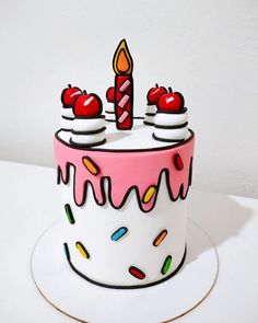 a birthday cake with candles and sprinkles on the top is decorated like an apple