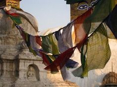 there are many different colored flags hanging outside