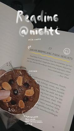 someone is holding up a book with an image of a chocolate cookie on the cover