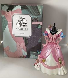 the figurine is next to an opened box