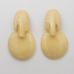 These stunning artisan studio hand-crafted modernist resin clip-on earrings were created by Marie Therese and Christian Migeon, known as Migeon & Migeon. The oversized dangling shape with a futuristic design has a light banana pearlized color. The company logo underside on the fastenings reads Migeon & Migeon - Paris. Measurements: 1.88 in wide (4.8 cm) x 3.57 in high (9 cm).  Note: Migeon & Migeon is a French husband and wife team who created furniture, accessories, and jewelry pieces between 1 Modern Handmade Clip-on Earrings, Modern Round Resin Earrings, Marie Therese, Futuristic Design, Husband And Wife, Clip Earrings, Furniture Accessories, Tortoise, Clip On Earrings