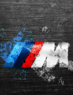 the word bmw painted in red, white and blue on a black background with paint splatters