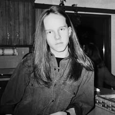 black and white photograph of woman in kitchen