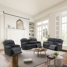 a living room with two recliners and a coffee table in front of a fireplace