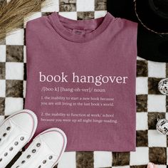 This trendy Book Hangover Definition T-shirt is the perfect gift for book lovers, librarians, and book worms. Made with high-quality, 100% ring-spun US cotton, this garment-dyed tee offers a soft color and texture. The double-needle stitching and seamless design ensure durability and a comfortable fit. With a relaxed fit and classic crew neckline, this shirt is versatile for both casual and semi-formal settings. Product features - Available in sizes S to 4XL for the perfect fit - Double-needle stitching for durability - Seamless design reduces fabric waste - Garment-dyed fabric for a soft texture - Made with 100% US cotton for comfort and sustainability Care instructions - Machine wash: cold (max 30C or 90F) - Do not bleach - Tumble dry: low heat - Iron, steam or dry: low heat - Do not dry Book Lover Aesthetic, Librarian Aesthetic, Funny Librarian Shirts, Librarian Tshirt, Bookish T-shirt With Funny Print For School, Gift For Librarian, Lover Aesthetic, Bookish Cotton T-shirt With Slogan, Book Hangover