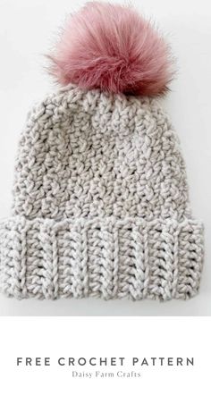 a knitted hat with pink pom - pom on top and the text free crochet pattern