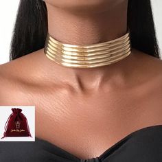 Statement leather choker, makes an impact with this irresistible leather embellishment with a gold motif line & adjustable leather closure. African jewellery with a glam ethnic touch. Product Details - Material: Acrylic and artificial leather - Our products are all nickel free and lead free  🚚 Free UK Delivery  🎁 Free Gift Packaging The Jarlia By Jolina collection consists of African Egyptian luxury jewellery. Jolina believes in the use of jewellery  to empower all women's beauty, allowing the African Choker, Gold Motif, African Jewellery, African Bracelets, Queen Jewelry, Leather Choker Necklace, African Earrings, Egyptian Jewelry, Luxury Jewellery