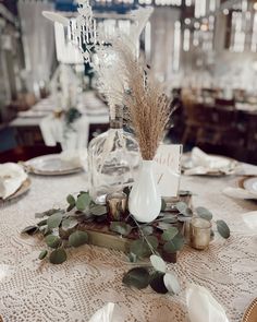 the table is set with an elegant centerpiece