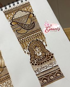 an intricately designed notebook with gold foil on it