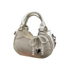 Vegan Pearl Bow Details Tote Bag Vegan Leather Upper Bottom Width: 20 cm / 7.9 inch (Approx.) Height: 14 cm / 5.5 inch (Approx.) Depth: 7 cm / 2.8 inch (Approx.) Length of Strap: 120 cm / 47.2 inch (Approx.) NOTE: Please use the chart & measurements as guide only, because sizing and measurements will vary between cuts and designs. Bow Tote Bag, Pearl Bow, The Label, Vegan Leather, 20 Cm, Leather Upper, Tote Bag, Shoulder Bag, Crochet