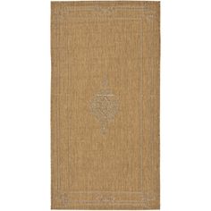 a tan rug with an ornate design on the front and back side, it is made from