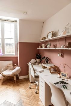 a room with a desk, chair and shelves on the wall next to a window