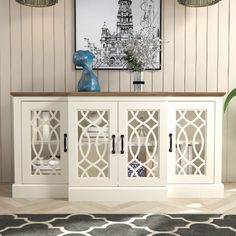 a white cabinet with glass doors in a room