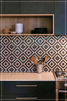 a kitchen with an oven, stove and cabinets