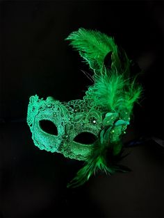 The brocade lace design with feathers adds a touch of sophistication and the jewels are carefully placed to catch the light and enhance your beauty. Securely and comfortably fits every face shape so you can enjoy a perfect evening at the masquerade ball.

Age Group/Gender - Adult/Women

Size/Type - One size fits all adults

Mask Color - Green

Mask Material - Polyresin/Fabric

Accent Material - Gems Black Swan Masquerade Mask, Emerald Green Masquerade Mask, Green Masquerade Mask, Elegant Masquerade Mask, Masquerade Mask Women, Dark Window, Theme Nights, Green Mask, Feather Mask