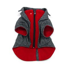 a gray and red dog jacket with zippers on the front, sitting on a white surface