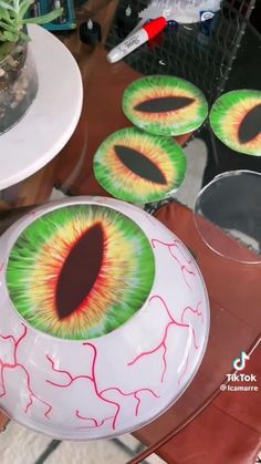 there are two plates with eyeballs painted on them