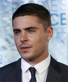 ceasar classic hairstyle, with slight fade, short guy haircuts, worn by zac effron, in black suit, with white shirt and navy tie Zac Efron Short Hair, Zac Efron Hair, Cool Boys Haircuts, Cool Mens Haircuts, Mens Haircuts Short, Best Short Haircuts