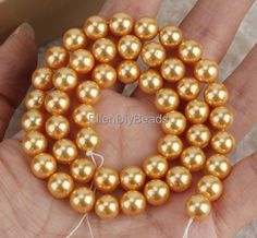 ON SALE  ♥ Item NO.:SH005    Material: shell pearl     Bead size : 8mm    Quantities: approx 48 pcs    Color:Deep gold    Length:15.5 inches    Note:have larger stock and can offer wholesale price.              If you need more quantity, please do not hesitate to contact me. ♥All of our products are taken with a camera at close range, so you can see their details more clearly. Some products may appear larger than the actual size. Please carefully check the size description in the list. The color of the product may be different due to different light, angle and background. The color of the product will also vary with the display. Note:have larger stock and can offer wholesale price. If you need more quantity, please do not hesitate to contact me. --------------------------------------- ♥ ♥ Gold Round Bead Pearl Necklace For Weddings, Gold Round Beads Pearl Necklace For Wedding, Gold Pearl Necklace With Round Beads For Wedding, Gold Pearl Jewelry With 8mm Beads, Gold Pearl Drop Necklace With Round Beads, Gold Pearl Necklace With Round Gold Beads, Pearl Wedding, Different Light, Shell Beads