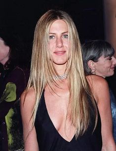 an image of a woman that is posing for the camera with her hair blowing in the wind