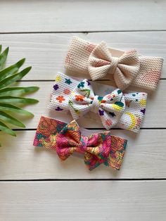 These adorable headwrap bows are perfect for baby shower gifts. They fit size premature, newborn and baby. The super stretchy fabric will grow with baby! The band is 2 inches thick and the bow is a 3 inch bow. Adjustable Hair Accessories With Butterfly Knot For Gifts, Adjustable Butterfly Knot Hair Accessory For Gift, Playful Adjustable Bow Headband, Cute Adjustable Bow With Matching Headband, Playful Adjustable Hair Accessories For Gifts, Cute Adjustable Headband With Bow Tie, Whimsical Adjustable Headband For Gifts, Whimsical Adjustable Headband For Gift, Playful Adjustable White Headband