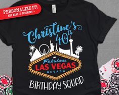 a black shirt with the las vegas birthday squad on it and some casino chips next to it