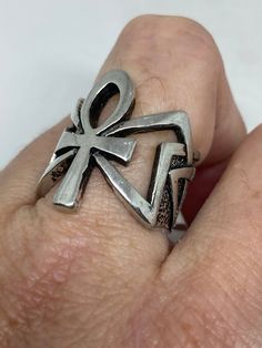 Cool Vintage Rock and Roll star men's ring Nice heavy ring vintage casting in silver white bronze Unused stock from the 1980's I have an assortment of sizes from 6.75, 7, 7.75, 12.75, 13, 13.25, 13.75 14 and 14.25 some half sizes. Please add your size to the order in a message and I will send the size you require. If I am out of stock in your size, I will list the ones I have available for replacement. My jeweler can re size them for a $20 fee. If I am sold out in the sizes you would prefer, I w Retro Silver Ring, Vintage Antique Silver Metal Rings, Retro Silver Ring Jewelry, Silver Ankh Shaped Pierced Jewelry, Unique Silver Ankh Jewelry, Retro Silver Rings For Collectors, Vintage Silver Ankh Jewelry, Bohemian Nickel-free Ankh Jewelry, Bohemian Ankh-shaped Bronze Jewelry