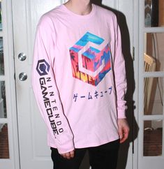 VaporWave style long-sleeve T-shirt available in 3 colors: White, Light Pink, Light Blue.  The right sleeve has the GameCube text logo printed on it.  Cotton shirt with water based ink.  Printed in house on our DTG equipment.  Please message me with any questions. Casual Long Sleeve Graphic T-shirt, Spring Long Sleeve Graphic T-shirt, Long Sleeve Text Print Shirt For Streetwear, Long Sleeve Shirt With Text Print For Streetwear, Text Print Long Sleeve Shirt For Streetwear, Cotton Long Sleeve Streetwear Tops, Long Sleeve Cotton Tops For Streetwear, Cotton Long Sleeve Tops For Streetwear, Graphic Long Sleeve T-shirt With Text Print