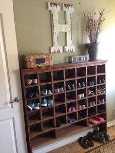 there is a shoe rack in the entry way