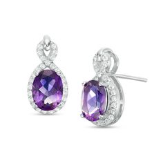 A splendid treat, these dazzling gemstone drop earrings are a captivating choice she’ll love. Fashioned in sterling silver, each luxe design showcases an 8.0 x 6.0mm oval-shaped bright purple amethyst center stone wrapped in a looping ribbon of glistening white topaz. Buffed to a brilliant luster and certain to stand out, these sparkling post earrings secure comfortably with friction backs. Elegant Formal Earrings With Accent Stones, Fine Jewelry Crystal Gemstone Earrings For Anniversary, Fine Jewelry Crystal Gemstone Earrings, Formal Cubic Zirconia Earrings With Accent Stones, Cubic Zirconia Earrings With Accent Stones For Formal Occasions, Formal Earrings With Cubic Zirconia Accent Stones, White Gold Earrings With Gemstone Accents For Anniversary, Elegant White Gold Earrings With Accent Stones, Anniversary White Gold Earrings With Gemstone Accents