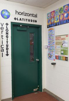 a green door is in front of a white wall with posters on it and the words horizontal latin