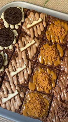 an assortment of cookies and desserts in a tray