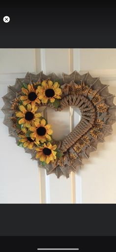 a sunflower wreath hanging on the front door