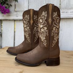 The price INCLUDES taxes and shipping anywhere in the United States. 
The JB-1501 cowgirl boot, in brown, has conquered hearts thanks to its unique and exquisite floral embroidery, a true symbol of Mexican western fashion. This boot represents the perfect combination of elegance and tradition, being considered by many as the ideal boot. Its square toe provides a modern and comfortable touch, while the cowhide sole guarantees durability and resistance. With a leather upper and lining, the JB-1501 Boots Mexican For Women, Boots Mexican, Boots For Women Cowboy, Vaquera Boots, Round Toe Cowboy Boots, Mexican Western, Mexican Boots, Western Boots For Women, Cowboy Hat Styles