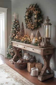 a christmas mantle with wreaths and ornaments on it