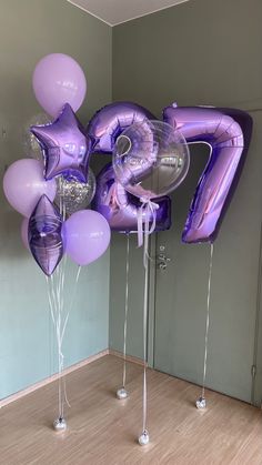 purple balloons are in the shape of an air balloon