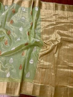 Beautiful Pista Green color Linen Soft Silk Saree with Weaved Buttas all over. Saree is super light weight and very Stable. Copper and Sliver Buttas on the body of the Saree while the Border and Pallu is Matt Gold. Please note - Since the material is tissue, it might looks lighter in shade in sunlight and darker in room-light specially in yellow light. Item : SareeColor : Pista GreenBase Fabric : Linen Soft Tissue Silk Blouse piece : YesBlouse material : Linen Soft Tissue Silk Transparent (Yes/N Pista Green Colour, Tissue Silk Saree, Pista Green, Men's Ethnic Wear, Bandhani Saree, Kanjivaram Sarees, Readymade Blouse, Kantha Stitch, Yellow Light