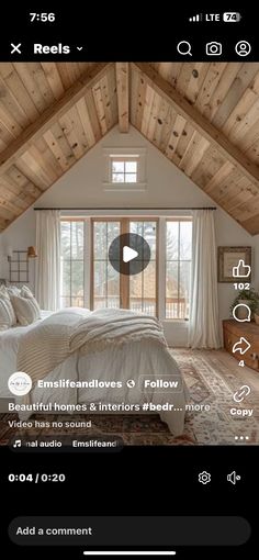 a bed room with a neatly made bed next to a window and a wooden ceiling