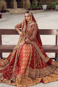 Pakistani Bridal Dress in Red Open Gown Lehenga Style in alluring red shade is embellished with goldwork, floral designs, dabka, and threads. Sequins, resham, and goldwork make this beautiful Red Lehenga dress an epitome of beauty and your foremost priority. Pakistani Bridal Pishwas: Pakistani Bridal Pishwas in open style comes in an alluring red color. The Pishwas Dress is gracefully emblazoned with zardosi, dabka, tilla, marori, and naqshi. The Traditional Pishwas is embellished with intricate designs, sequins, floral designs, and goldwork giving it a flawless finishing look. Bridal Lehenga: The Bridal Lehenga has premium quality jamawar fabric and it looks perfect when paired with the heavily embellished Open Pishwas Frock. The Lehenga has a stunning contrast of red and burnt orange. Go Pishwas Pakistani, Bridal Pishwas, Bridal Lehenga Pakistani, Gown Lehenga, Pakistani Bridal Lehenga, Lehenga Dress, Pakistani Bridal Dress, Bridal Dupatta, Frock Style