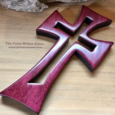 a wooden cross sitting on top of a table