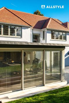 large aluminium sliding patio doors in painswick colour (RAL 7038) powder coating. smart visoglide plus profiles with slim sight lines, by Allstyle Aluminium Ral 7038 Agate Grey, Aluminium Orangery, Aluminium Patio Doors, Flat Roof Extension, Kitchen Extensions, Grey Patio, Aluminium Sliding Doors, Extension Ideas, Grey Houses