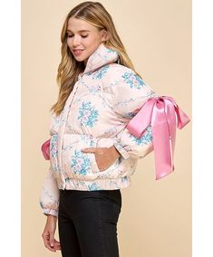 Floral puffer jacket with bow knot elbow string and a collared neckline. Zipper and button closure. Featuring side pockets. 100% Polyester Trucker Hat Fashion, Southern Girls, Gameday Dress, Bow Knot, Outerwear Vest, Girls Dream, Cardigan Jacket, Puffer Jacket, Playsuit Jumpsuit