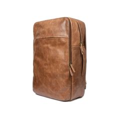 a brown leather backpack on a white background