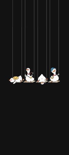 four ducks floating in the air on strings