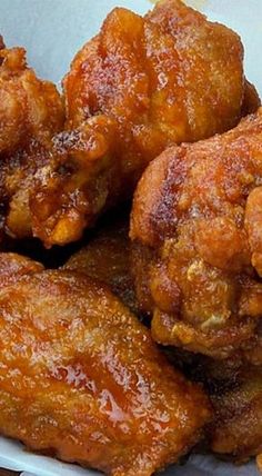 some fried food in a white bowl on a table