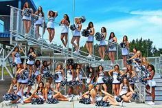 a group of cheerleaders posing for a photo